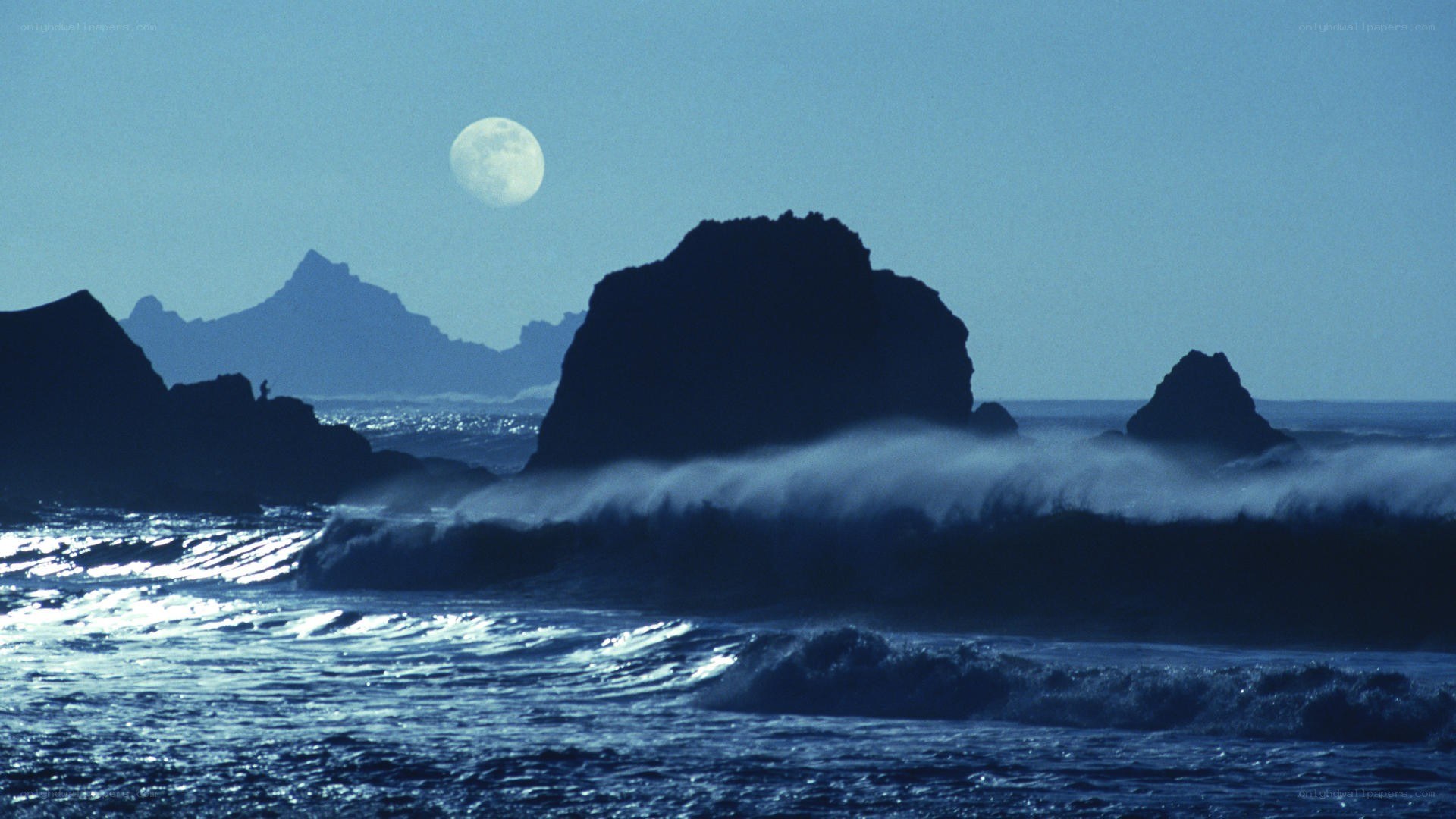 Moon over ocean waves