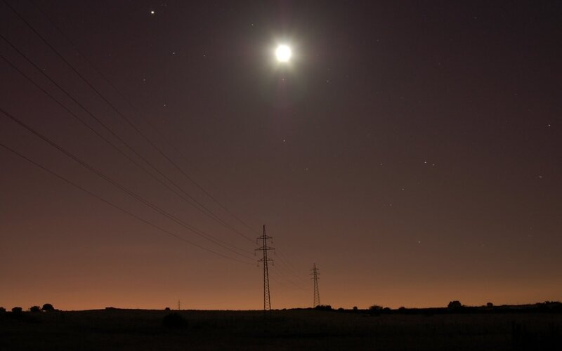 Moon over power lines
