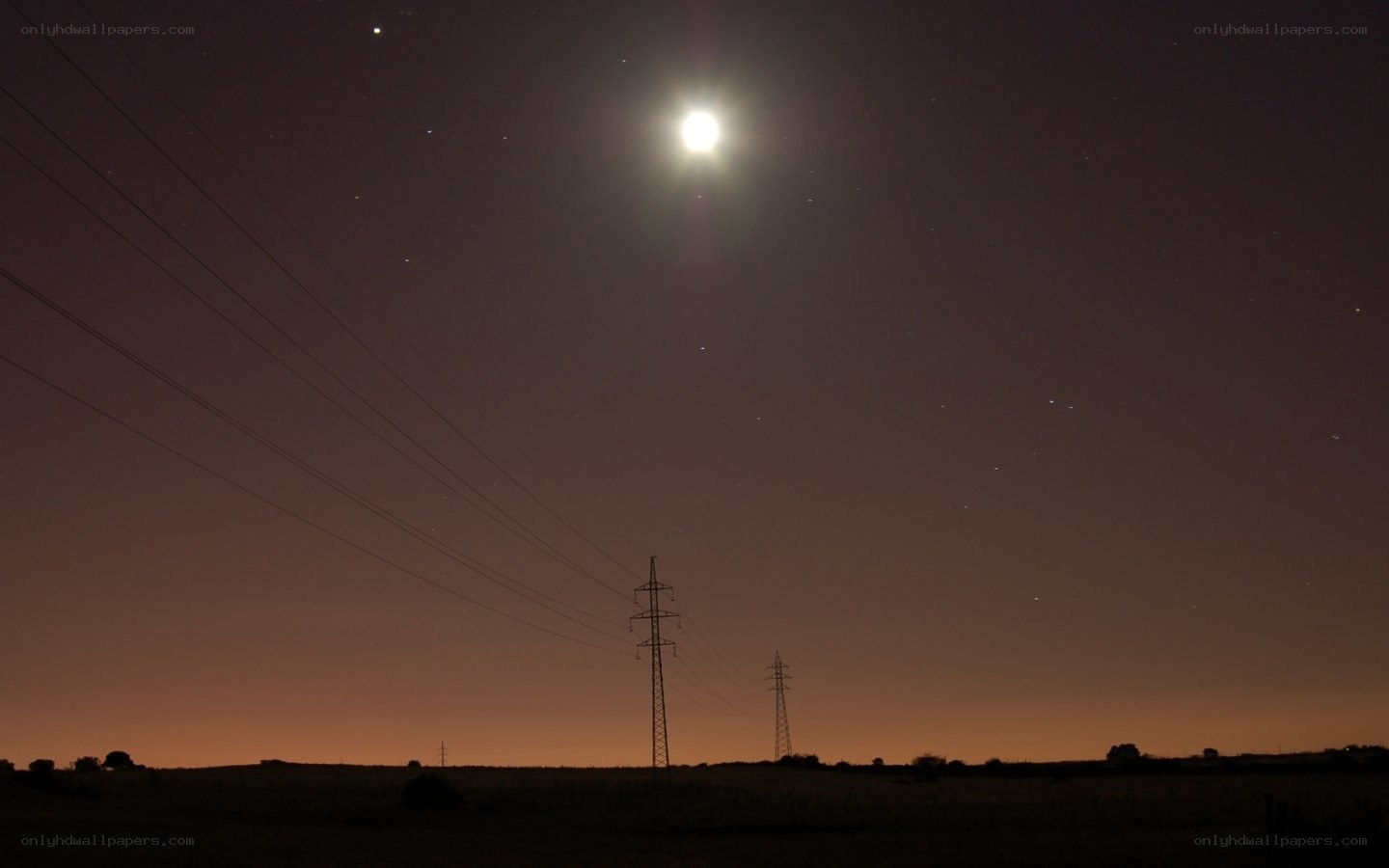 Moon over power lines