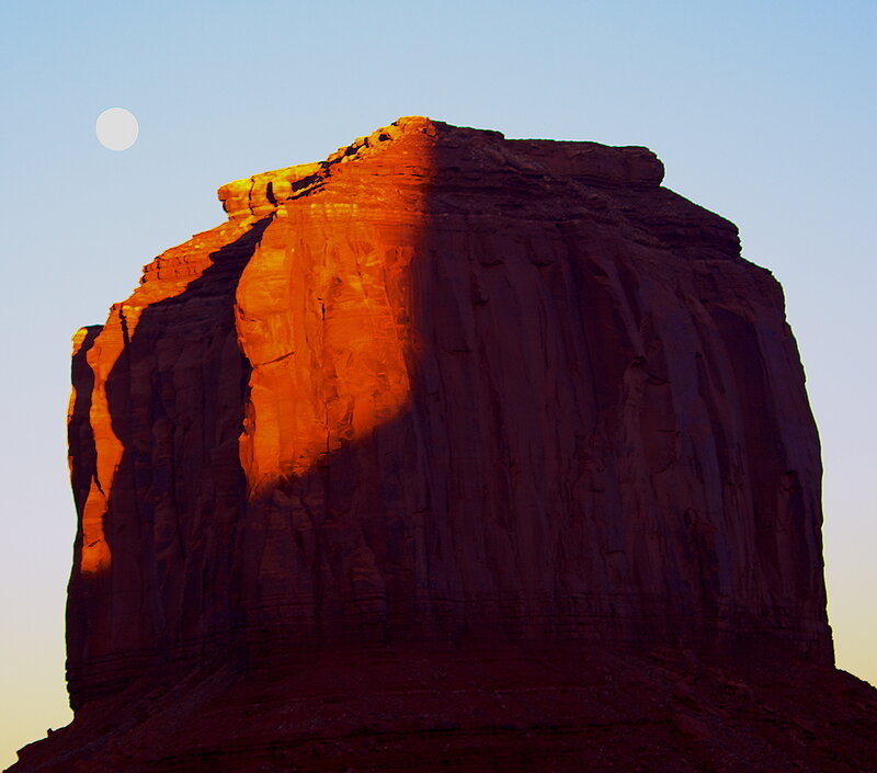 Moon over red rock formation
