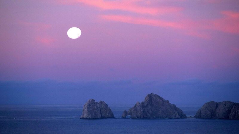 Moon over rocky islands