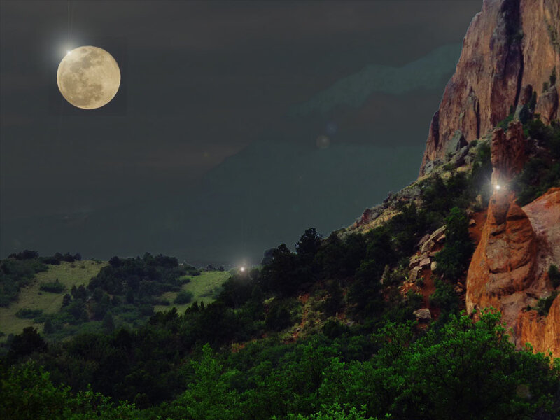 Moon over rocky landscape