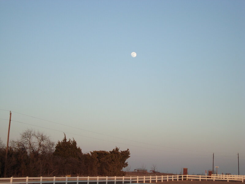 Moon over rural landscape