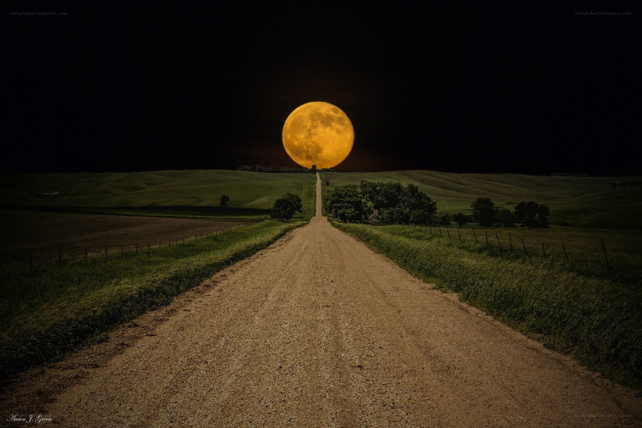 Moon over rural road