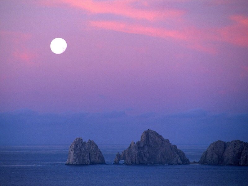 Moon over sea rocks