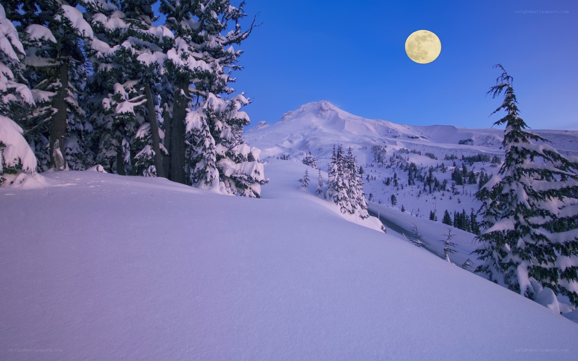 Moon over snowy mountain