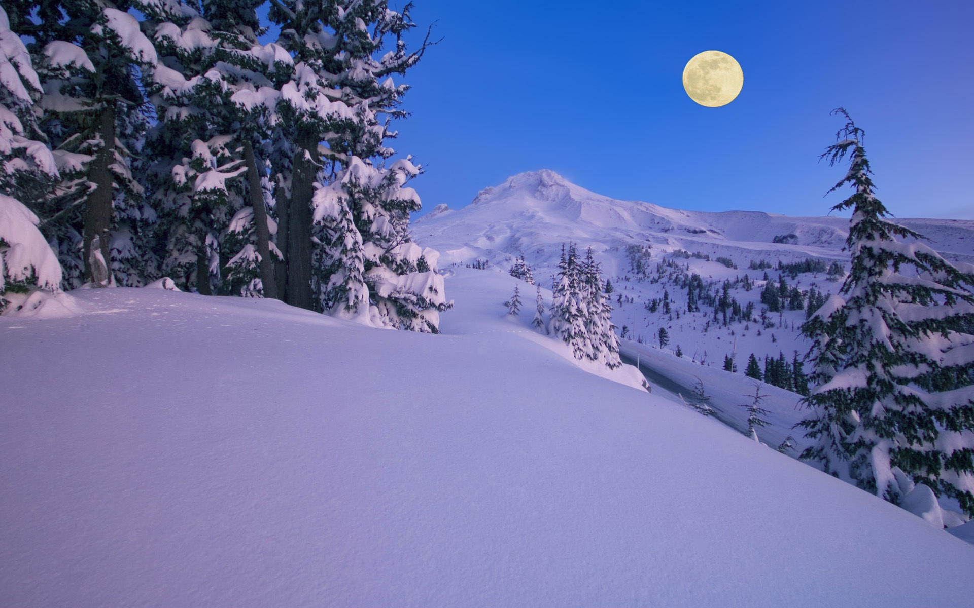 Moon over snowy mountain