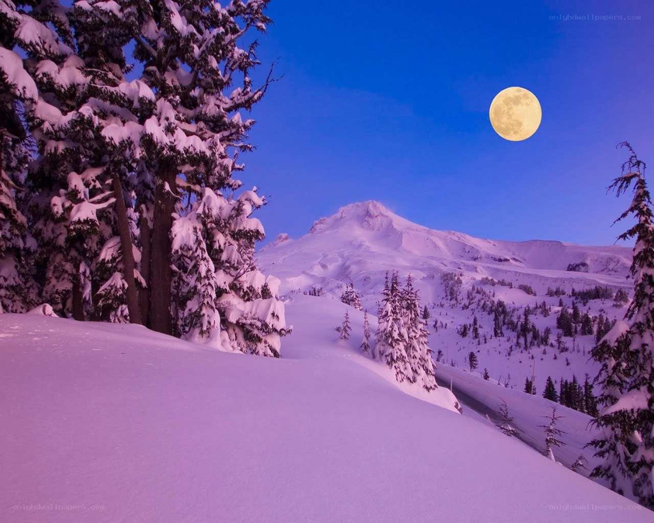 Moon over snowy mountain
