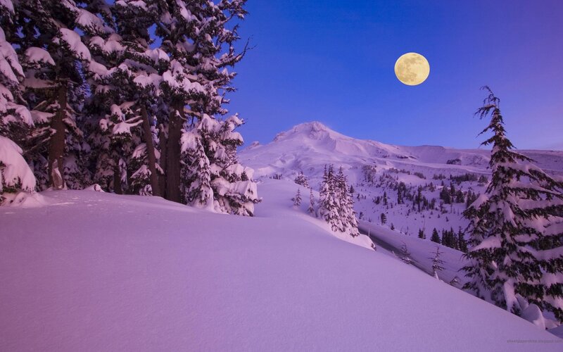 Moon over snowy mountain