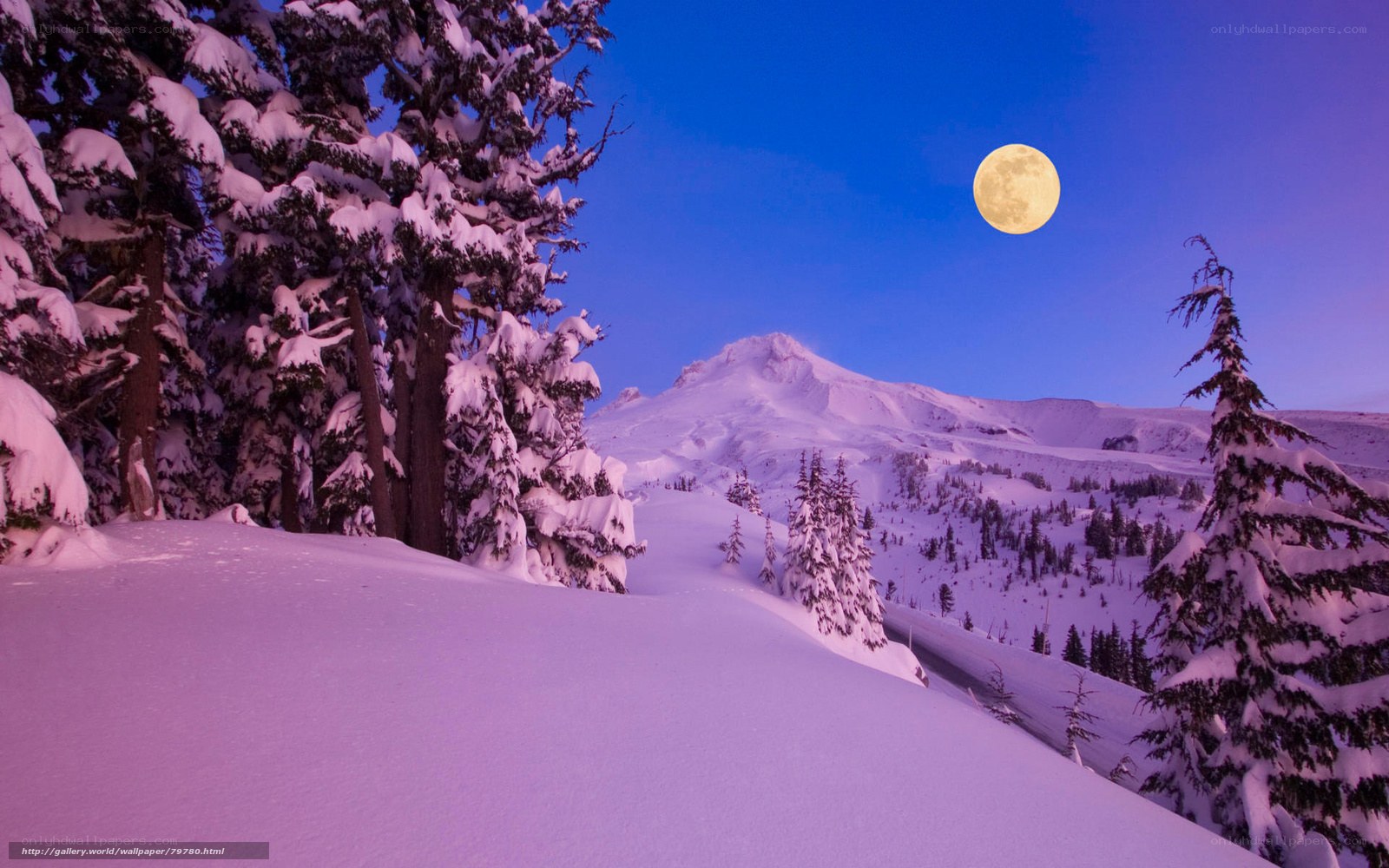 Moon over snowy mountain