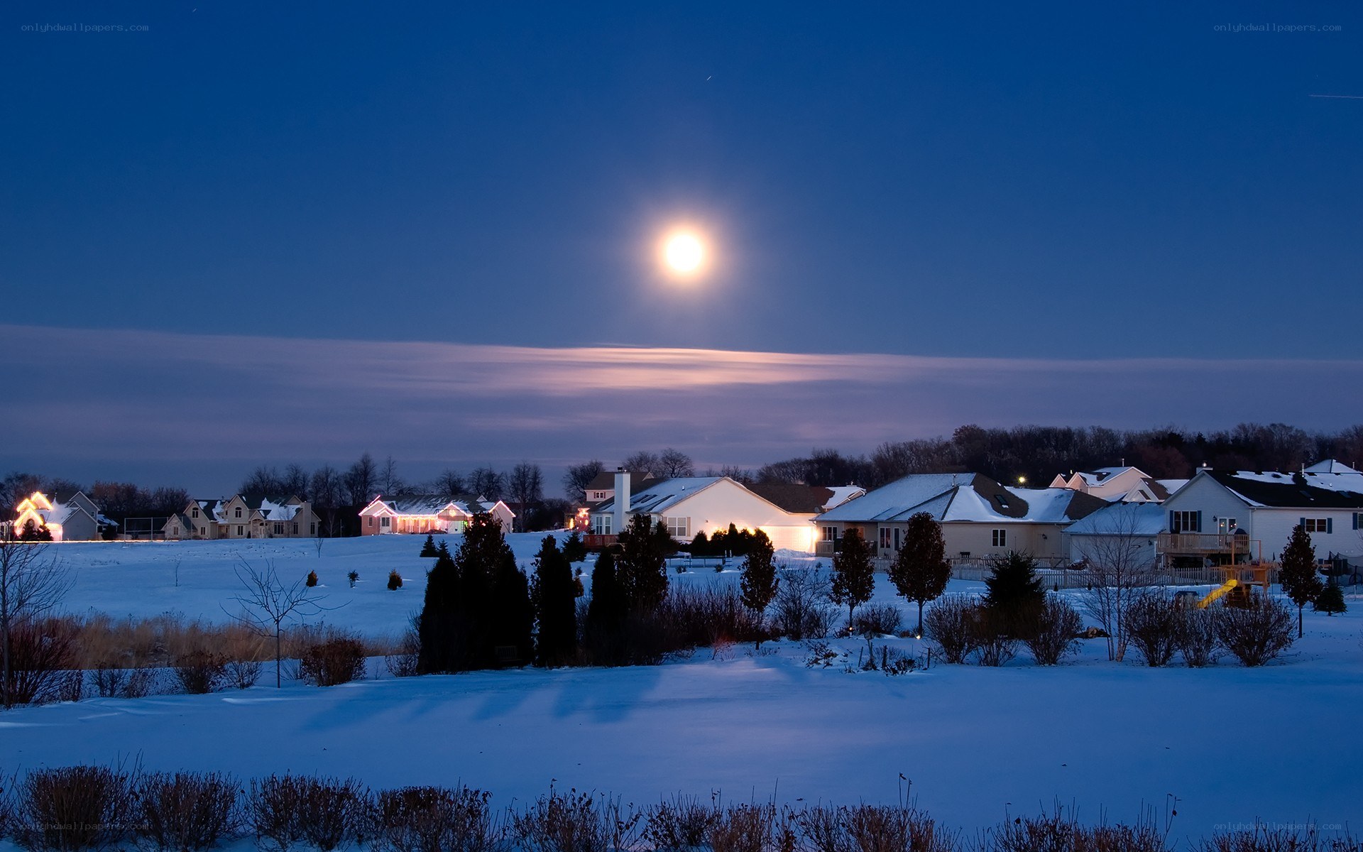 Moon over snowy neighborhood