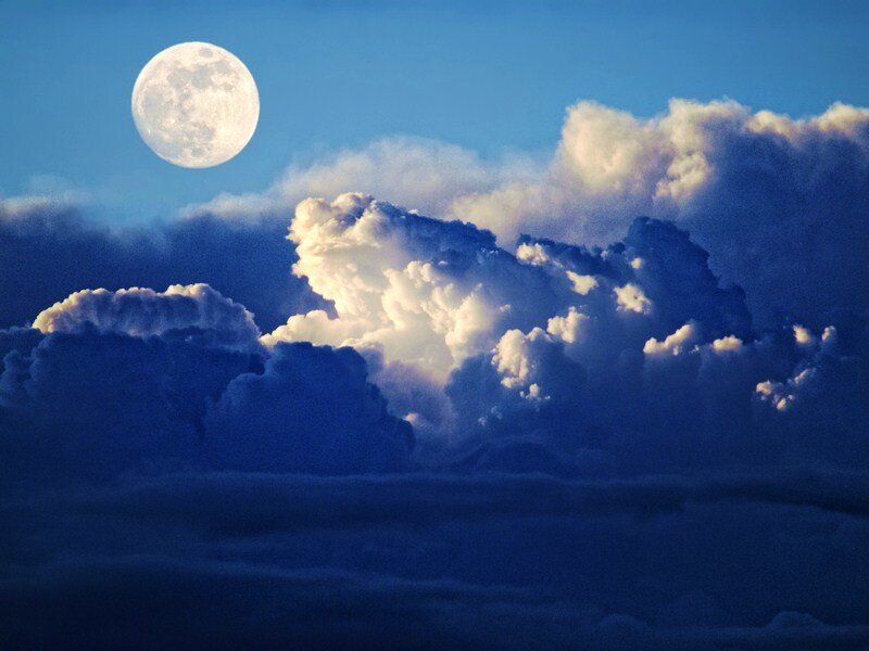Moon over storm clouds