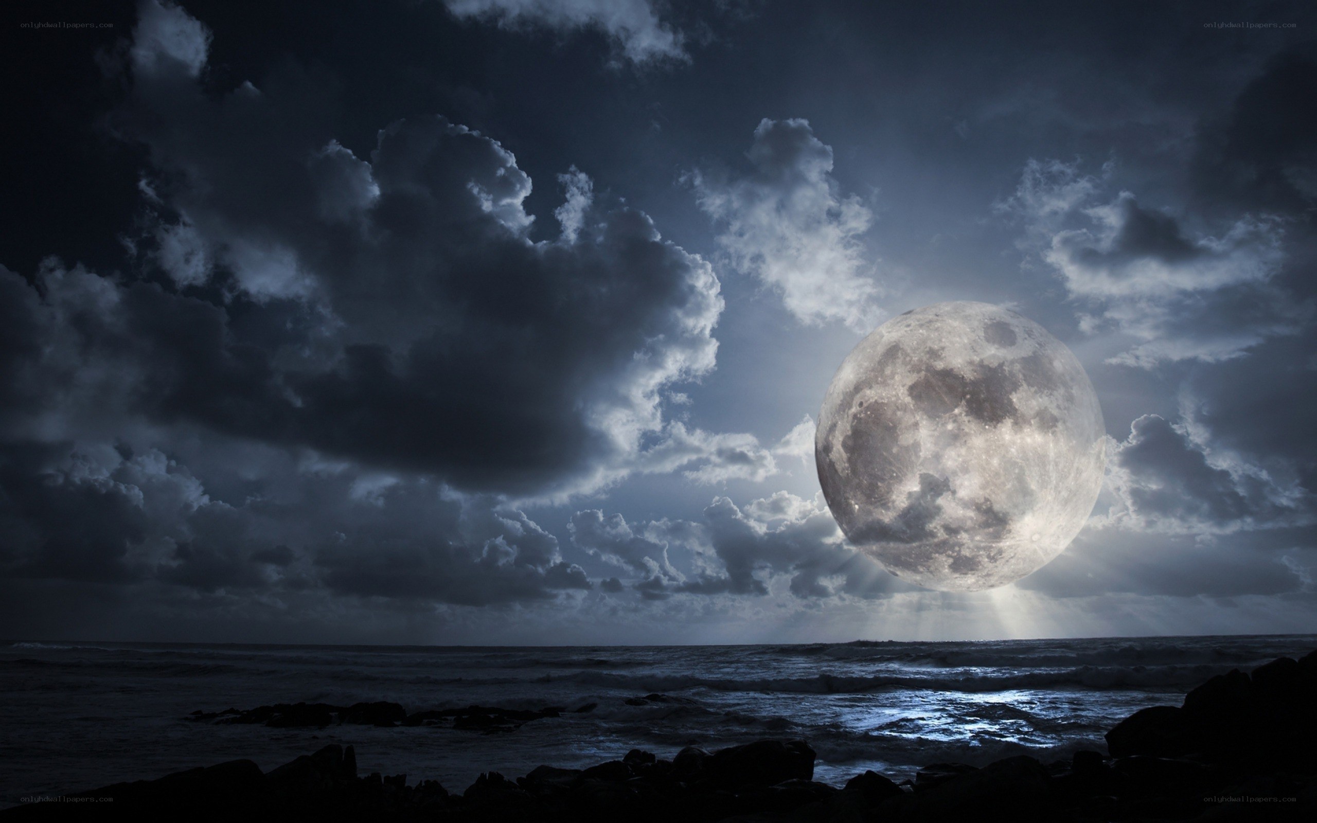 Moon over stormy sea