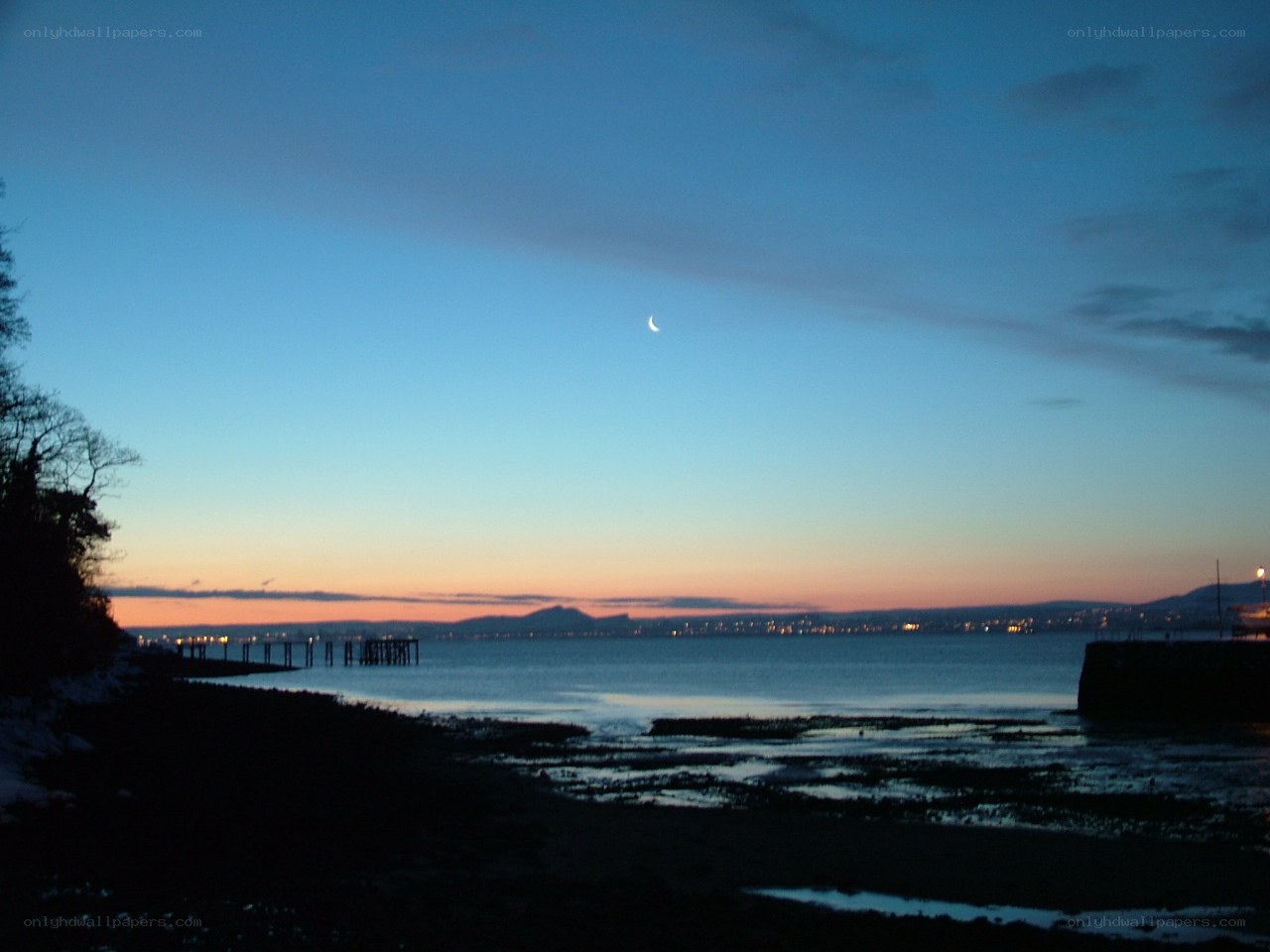 Moon over the bay at dusk