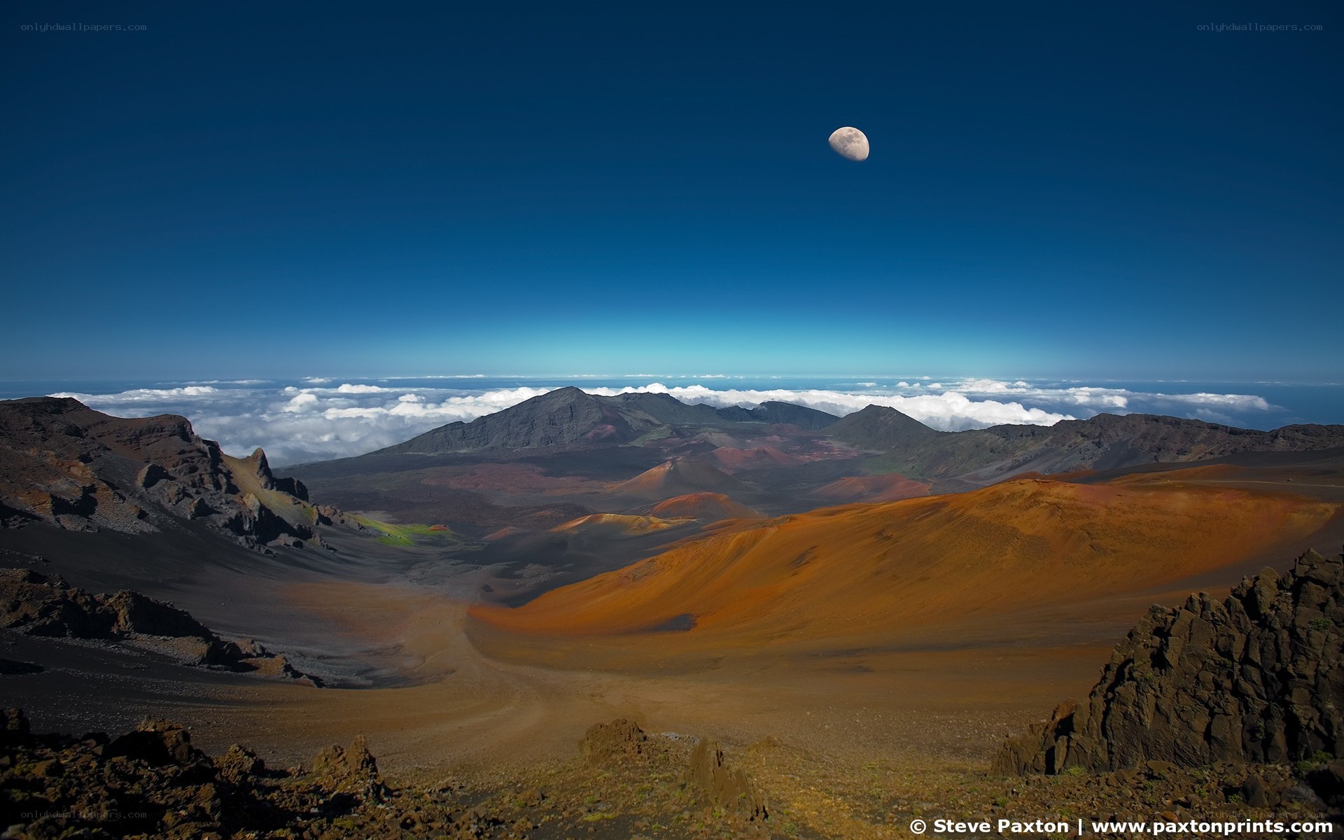 Moon over volcanic crater