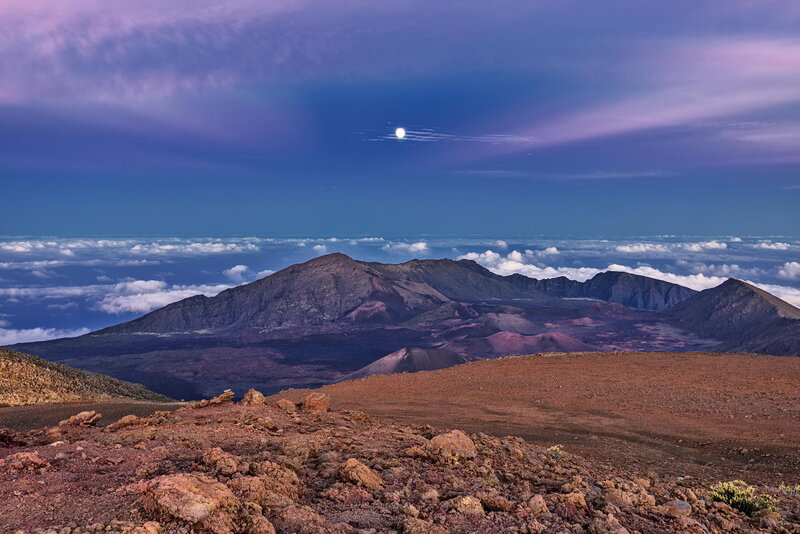 Moon over volcanic landscape