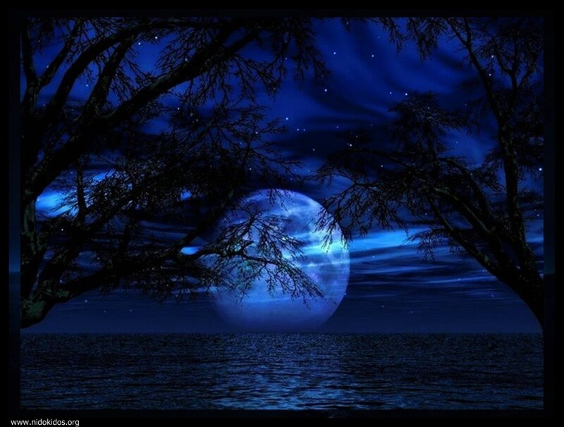 Moon over water at night