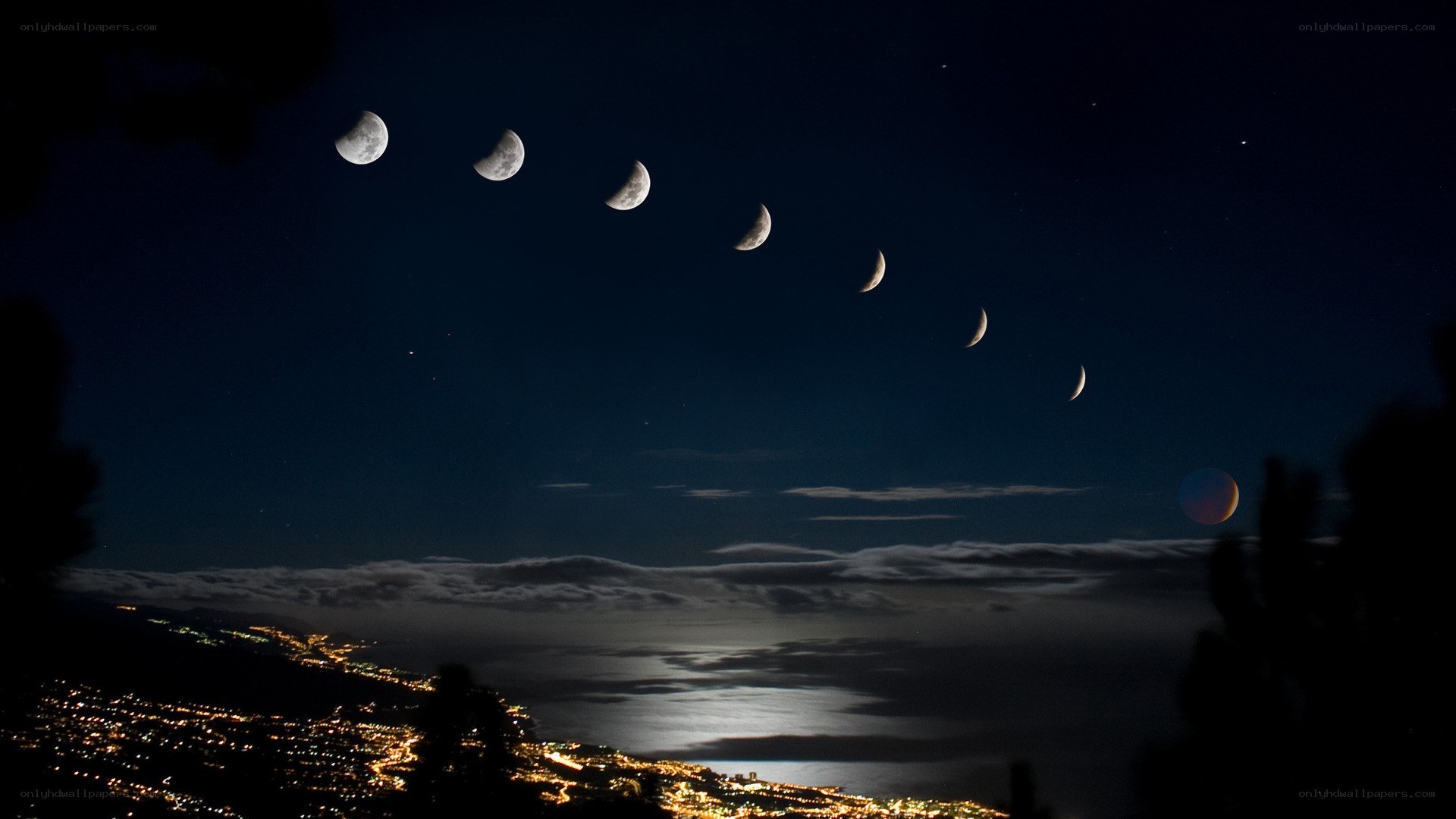 Moon phases over coastal city