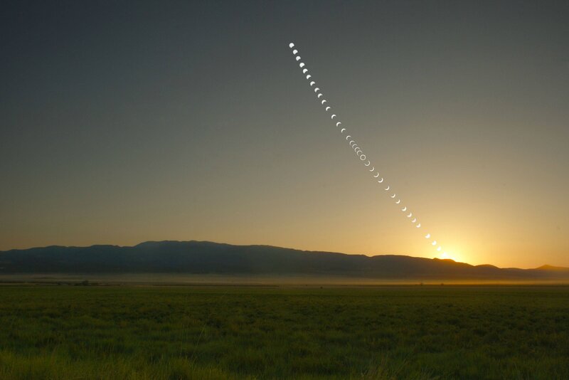 Moon phases over sunrise