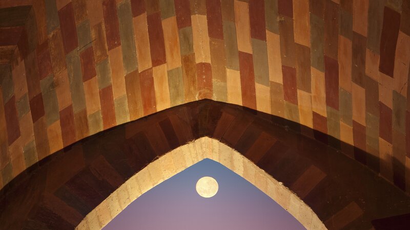 Moon through an arched window