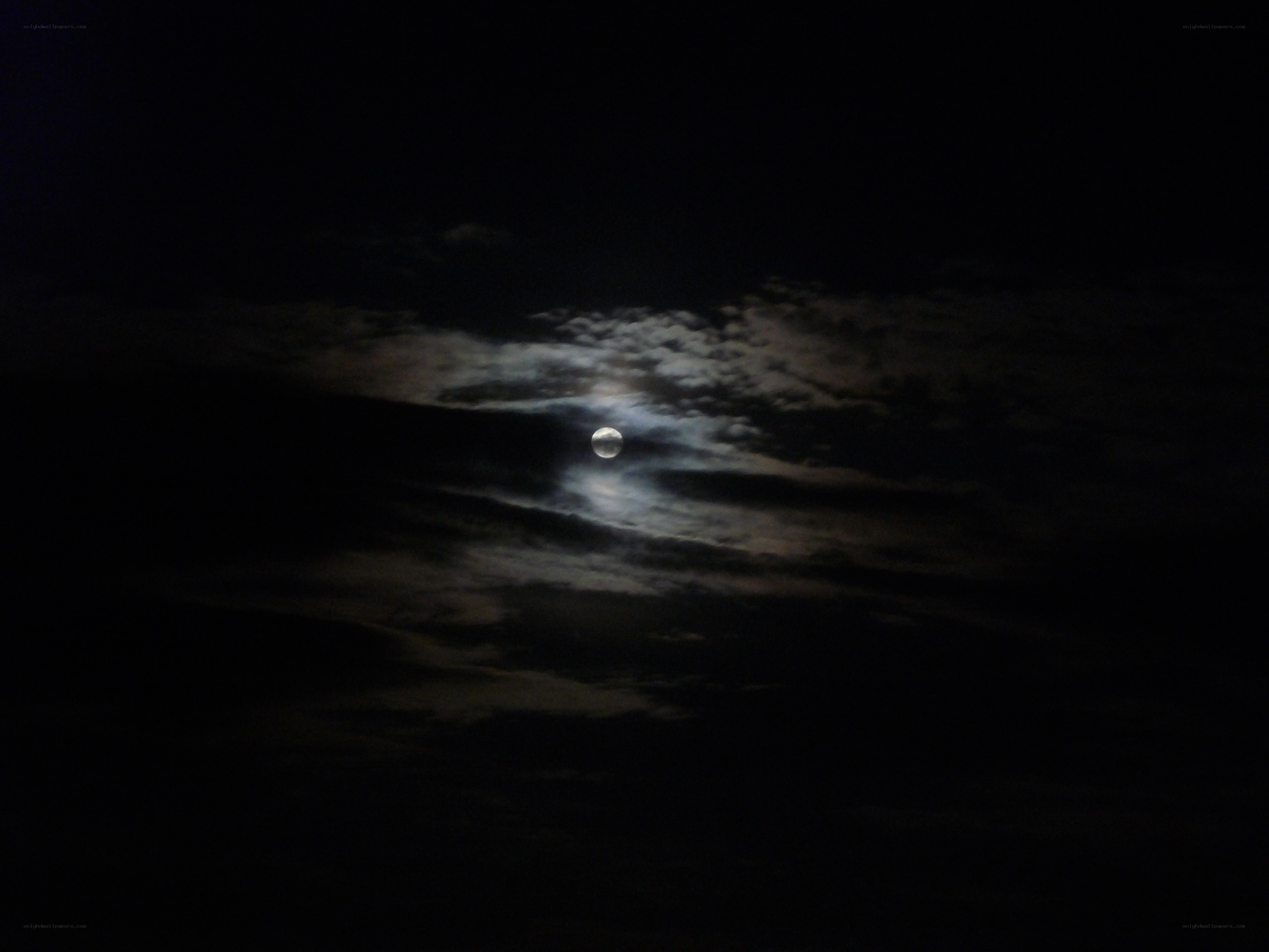 Moon through clouds at night