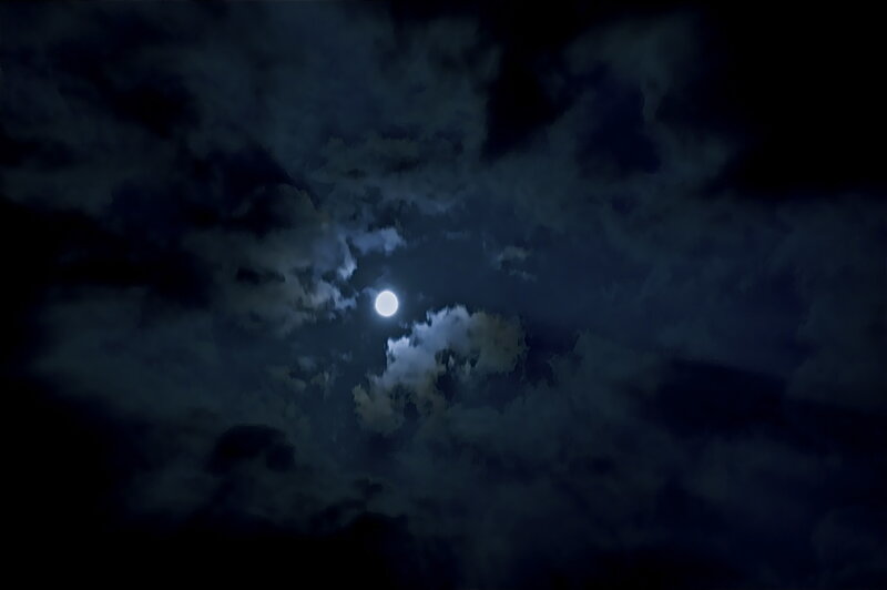 Moon through clouds at night