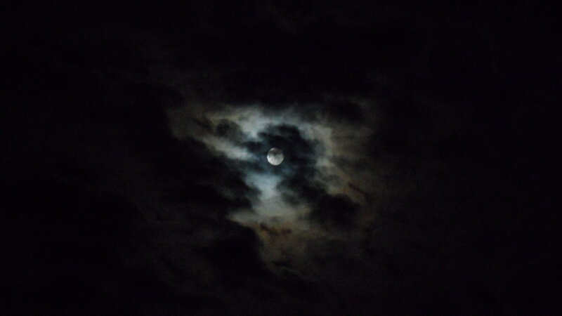 Moon through clouds at night