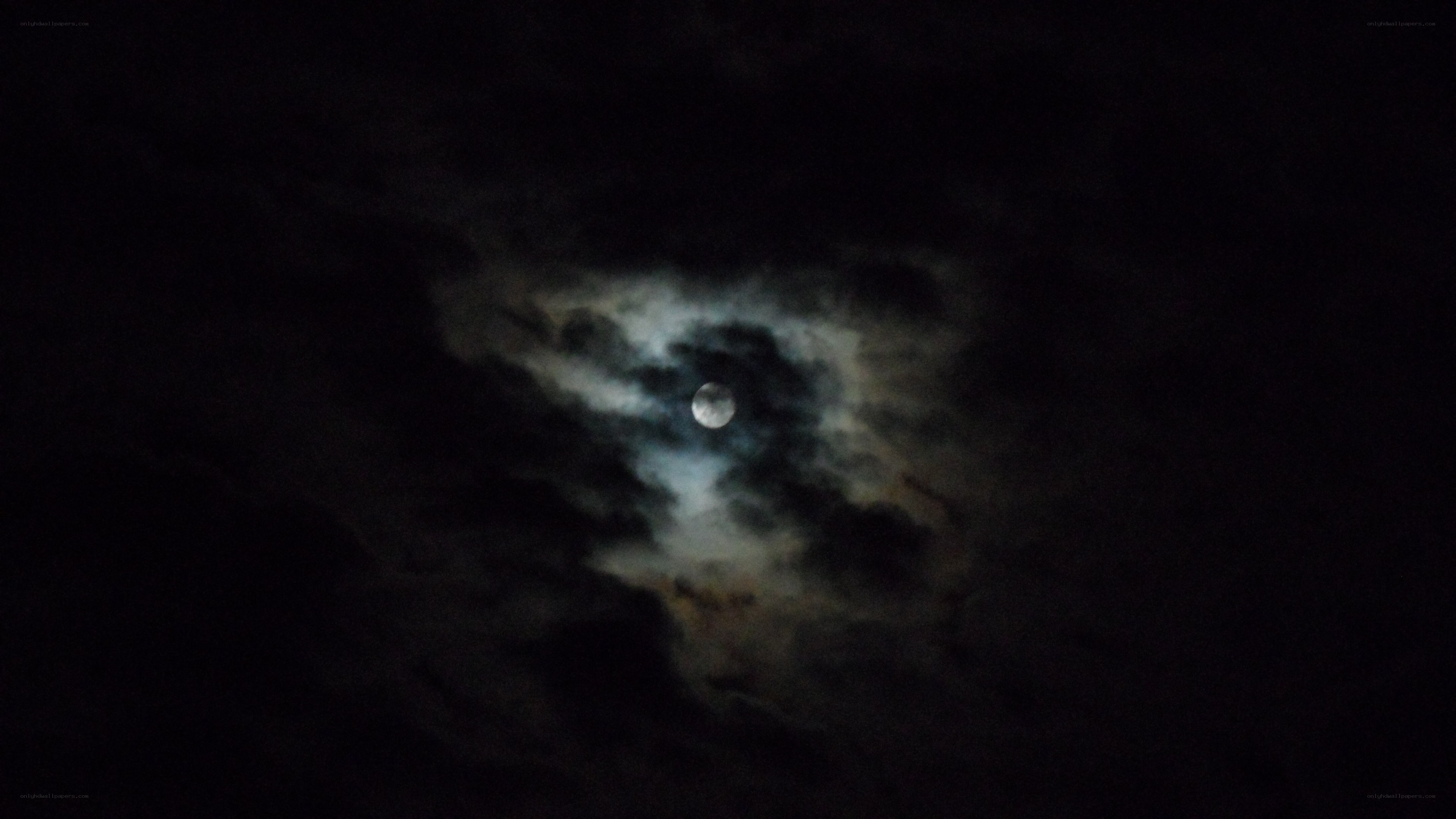Moon through clouds at night