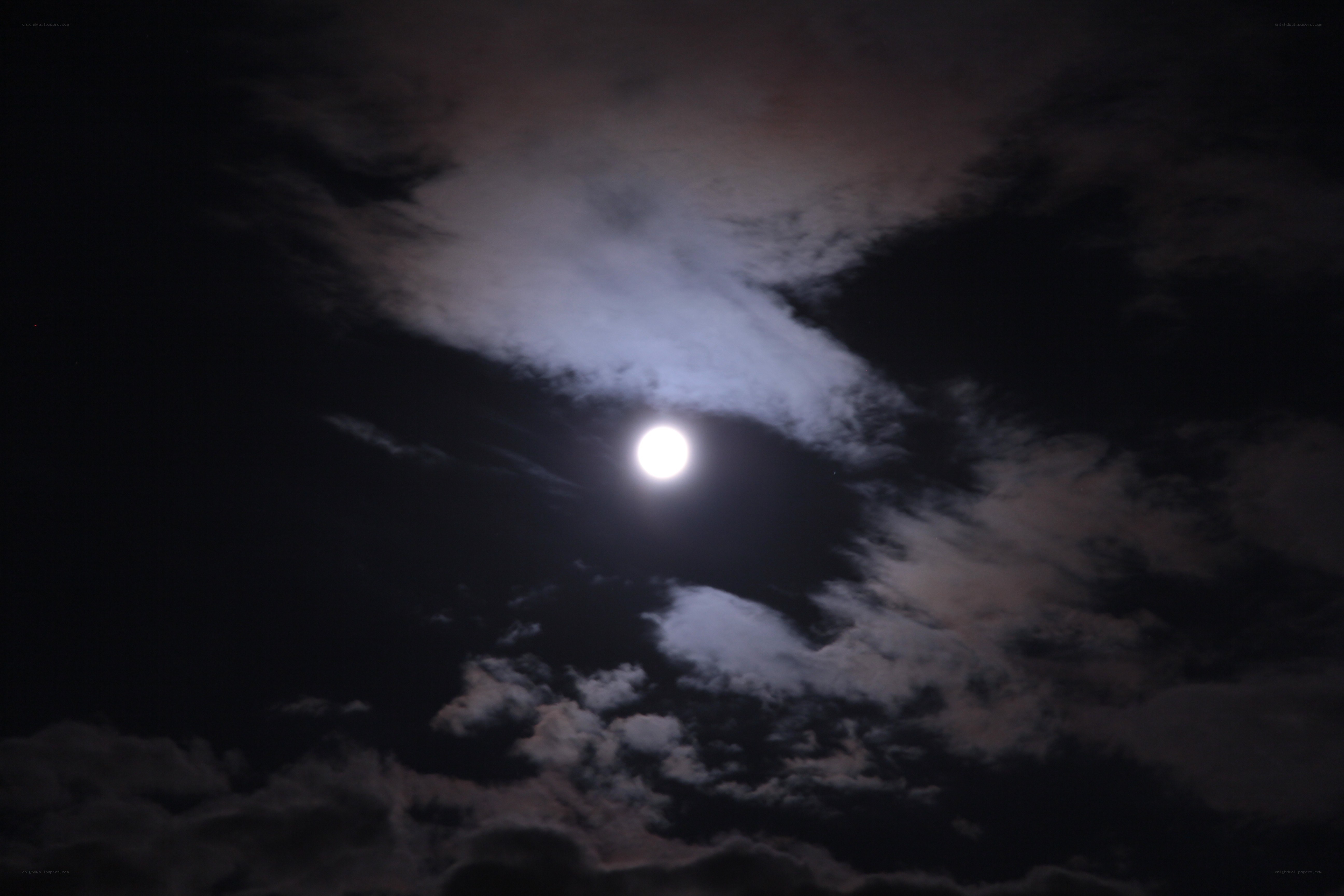 Moon through clouds at night