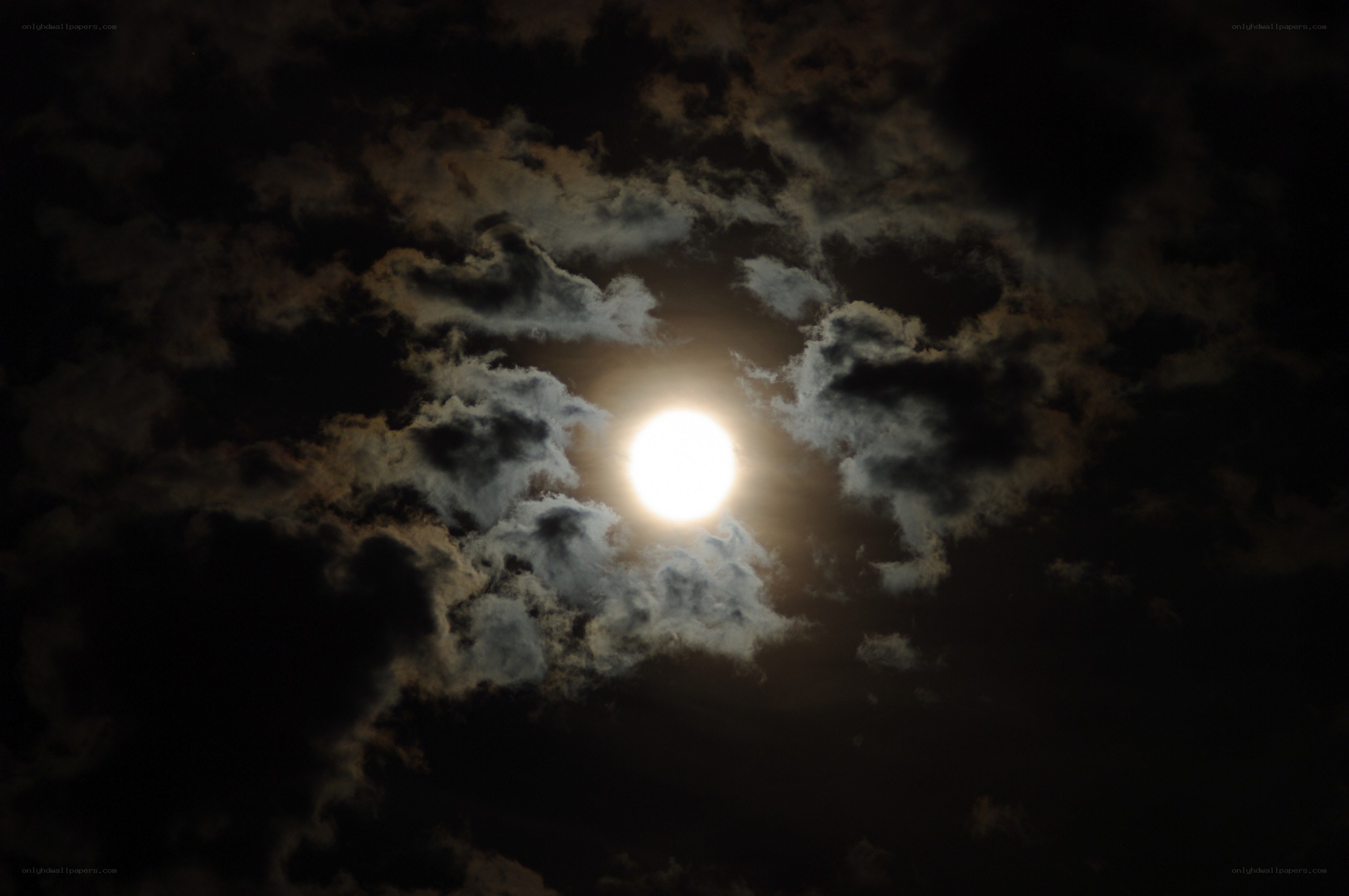 Moon through clouds at night