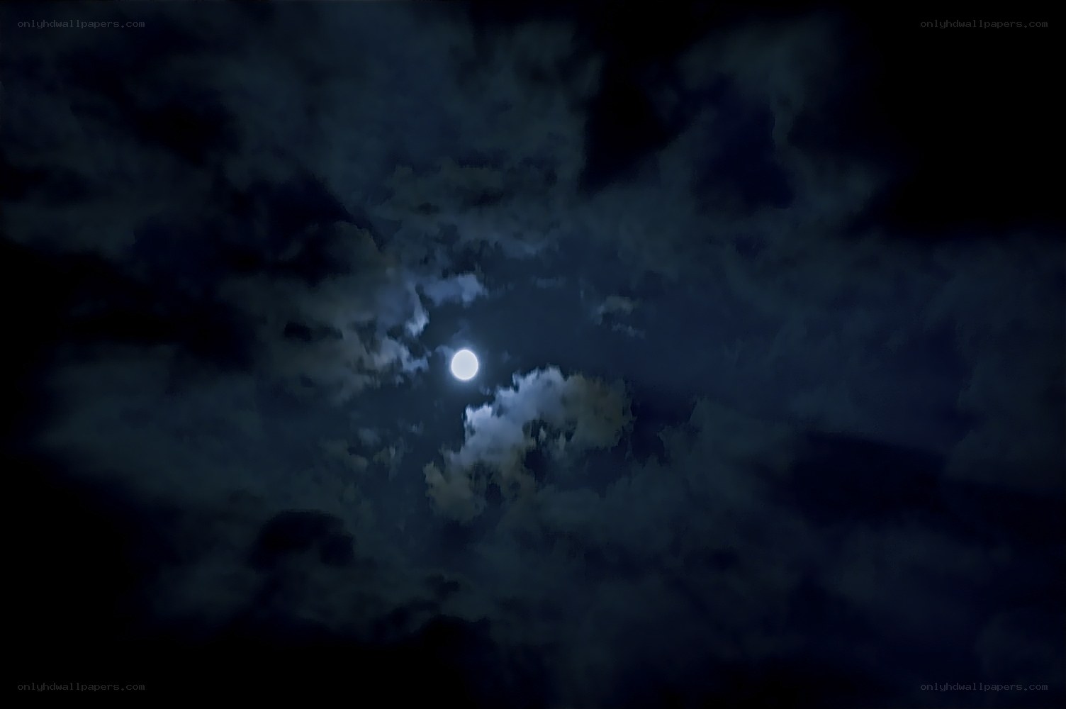 Moon through clouds at night