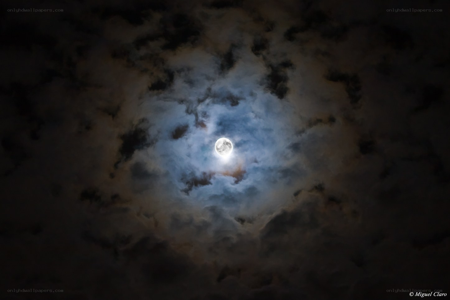 Moon through cloudy sky