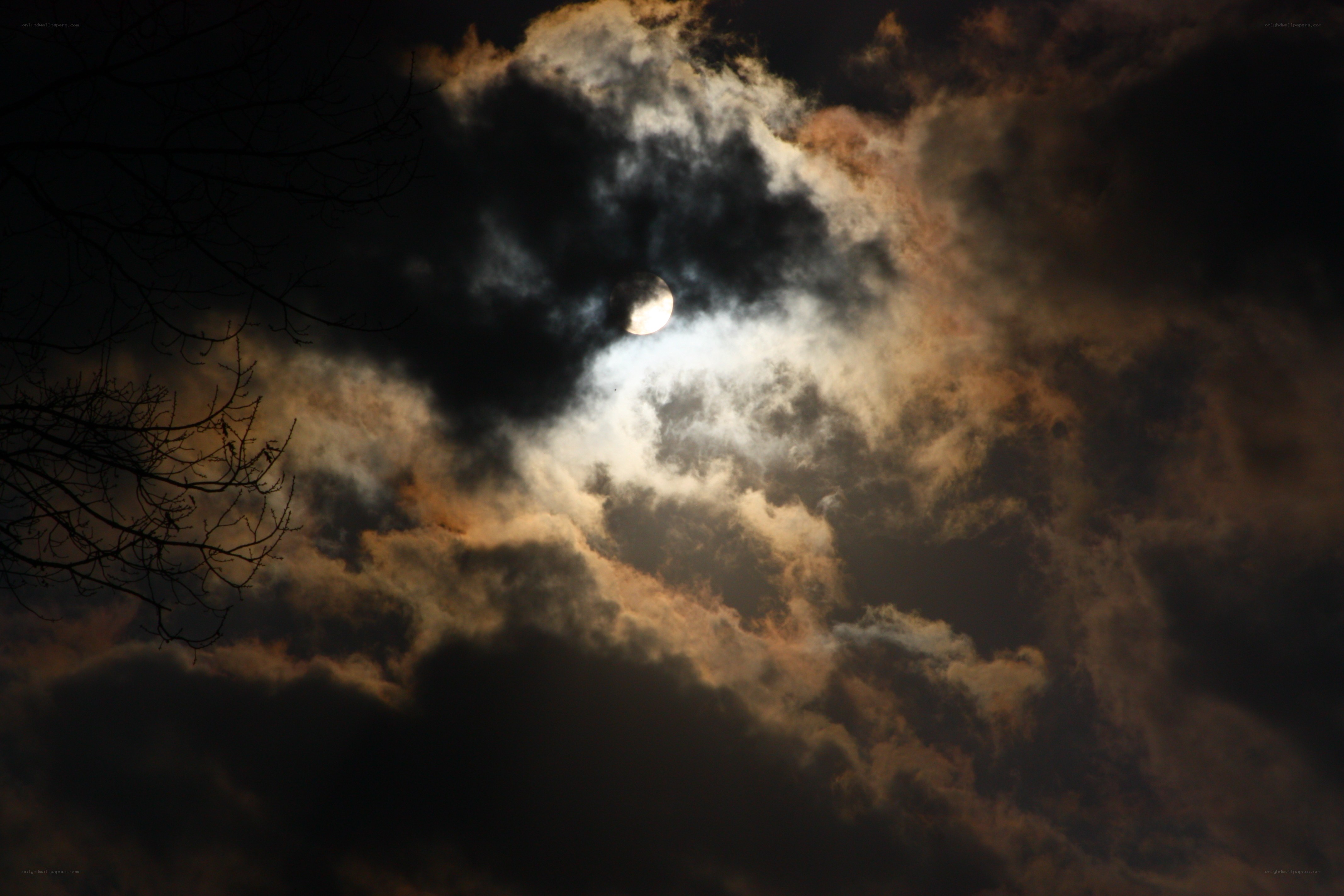 Moon through cloudy sky