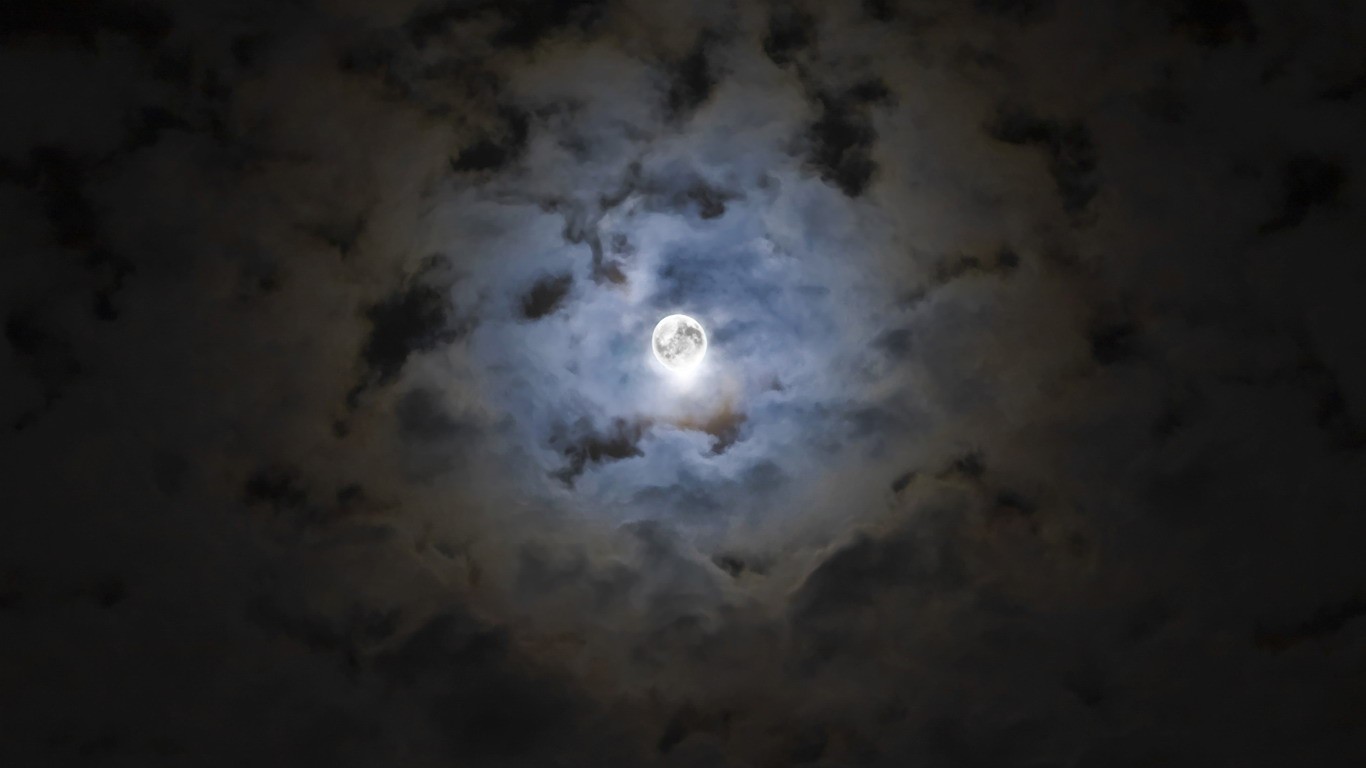 Moon through cloudy sky