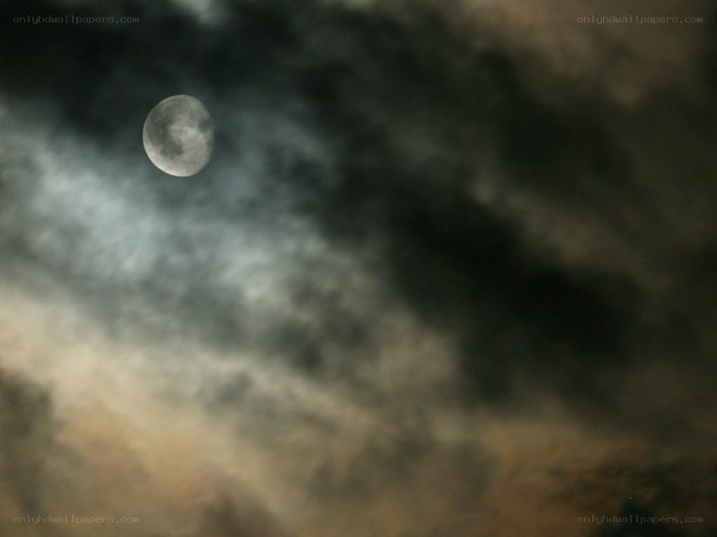 Moon through cloudy sky