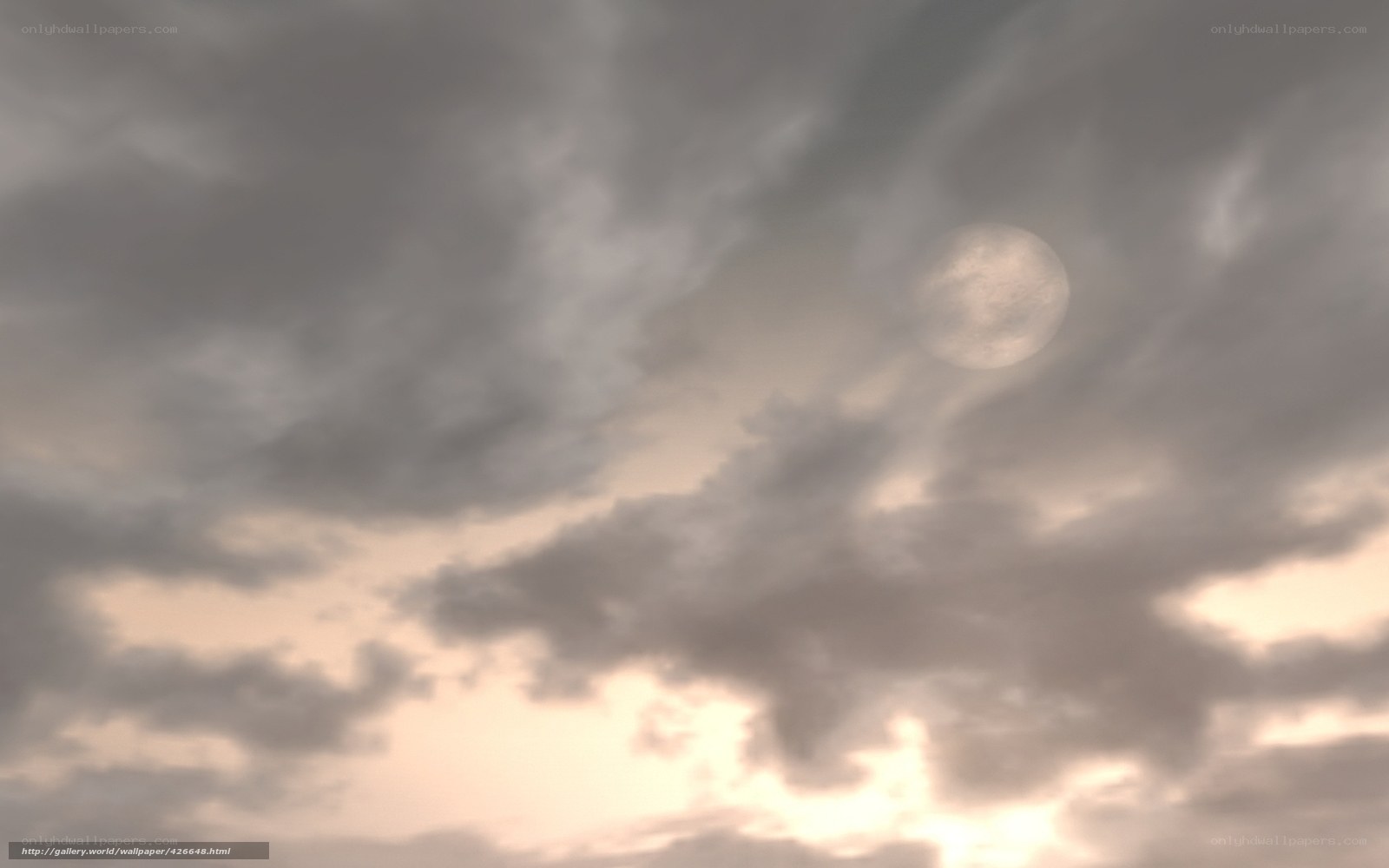Moon through cloudy sky