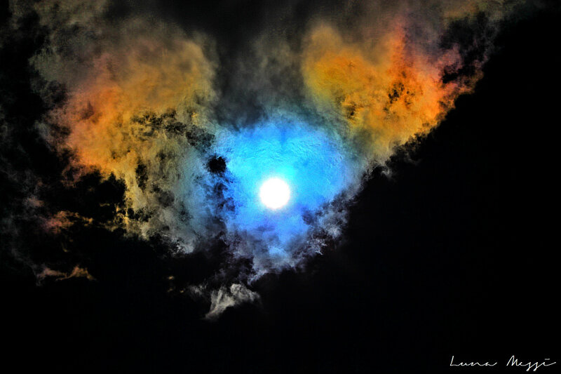 Moon Through Colorful Clouds