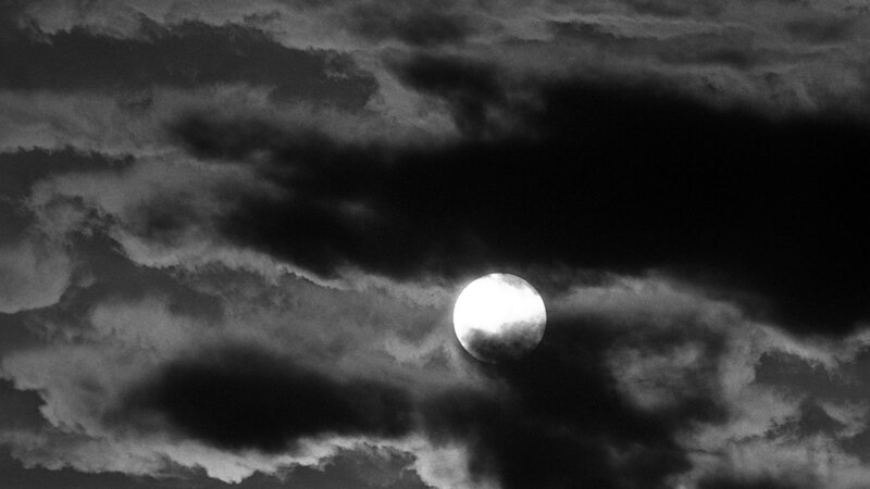 Moon through storm clouds