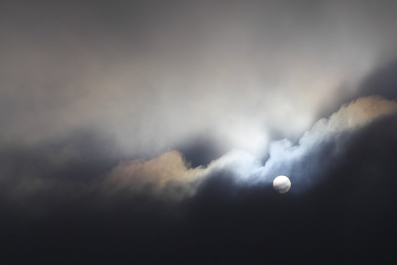 Moon through storm clouds