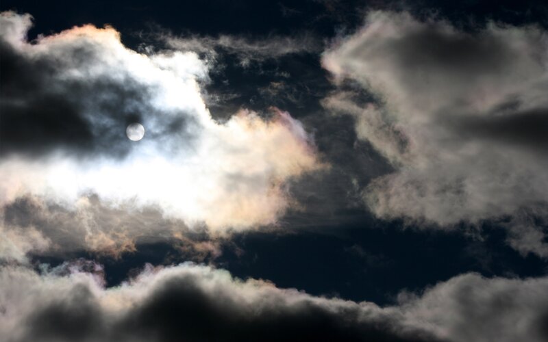 Moon through stormy clouds