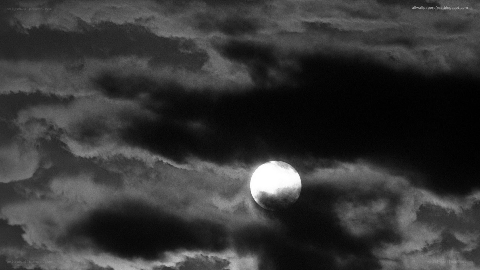 Moon through stormy clouds