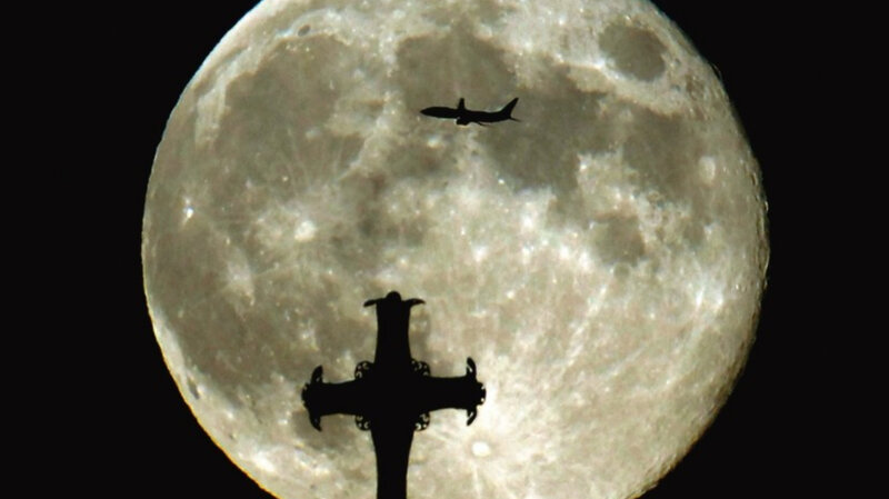 Moon with airplane and cross