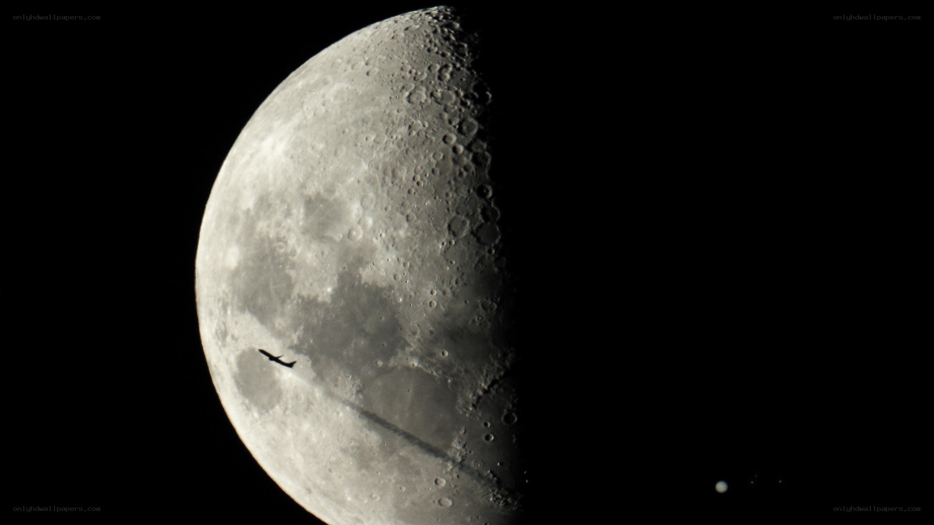Moon with airplane silhouette