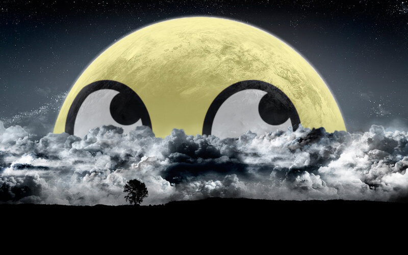 moon with eyes over clouds