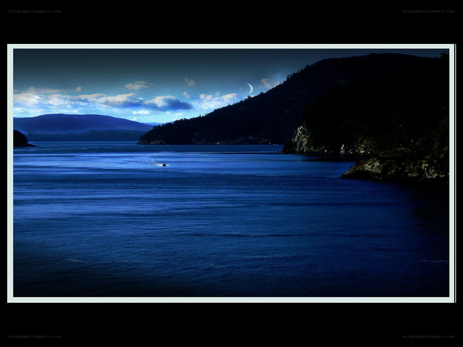 Moonlit bay with boat