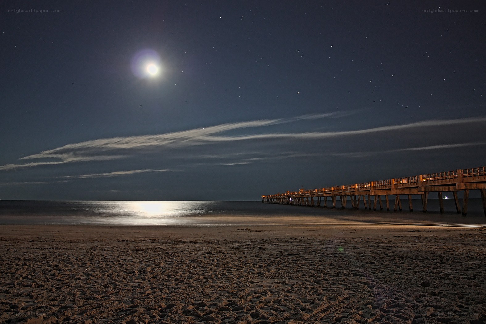 Moonlit beach at night