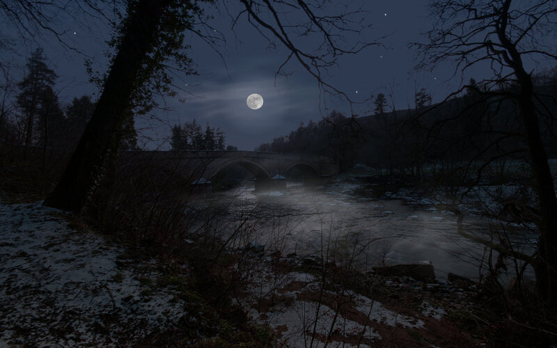Moonlit bridge over river