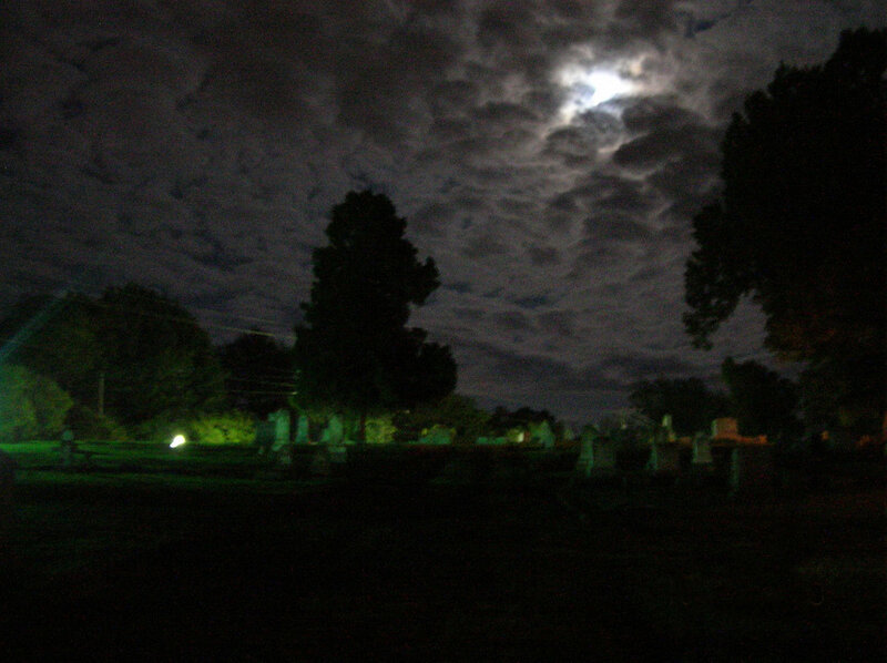 Moonlit cemetery at night