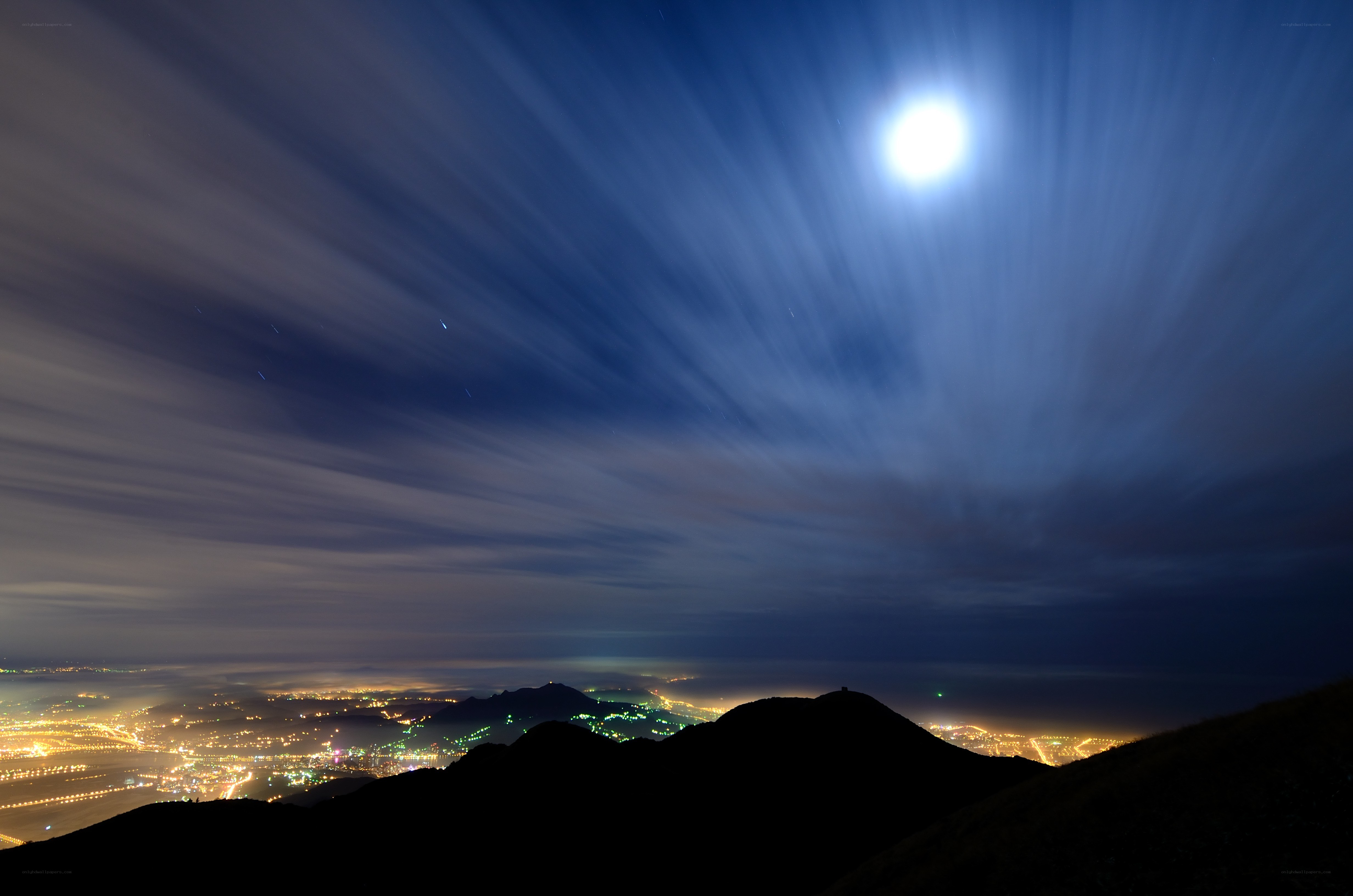 Moonlit cityscape at night
