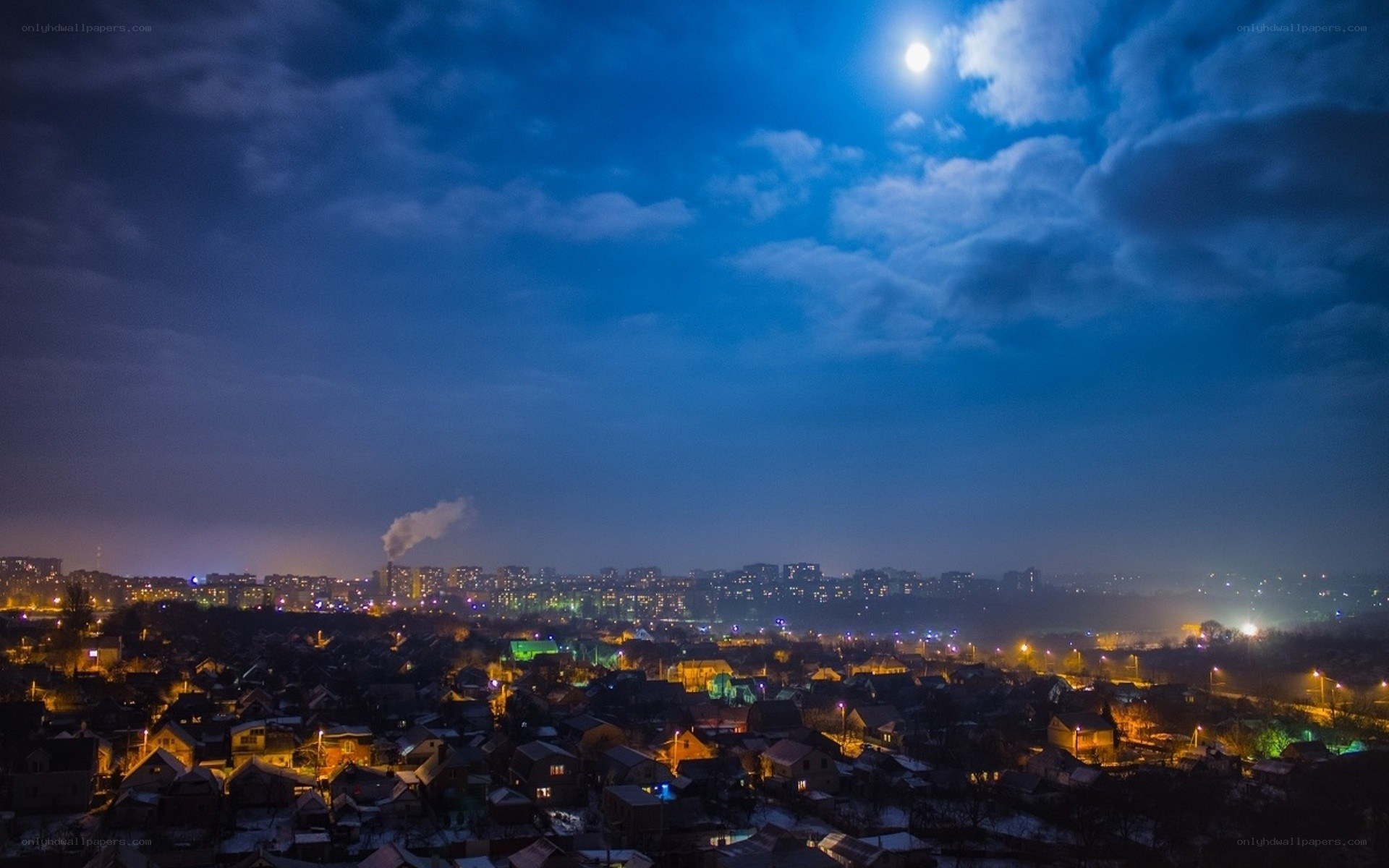 Moonlit cityscape at night